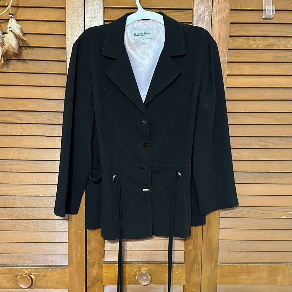 Lightweight black jacket. Pink lining. Rarely worn.